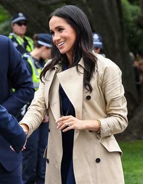 Meghan Markle cuts elegant silhouette in £1.8k trench coat and 